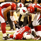 Kurt Warner lies injured during a 2010 game against theNew Orleans Saints. (Ronald Martinez/Getty Images)